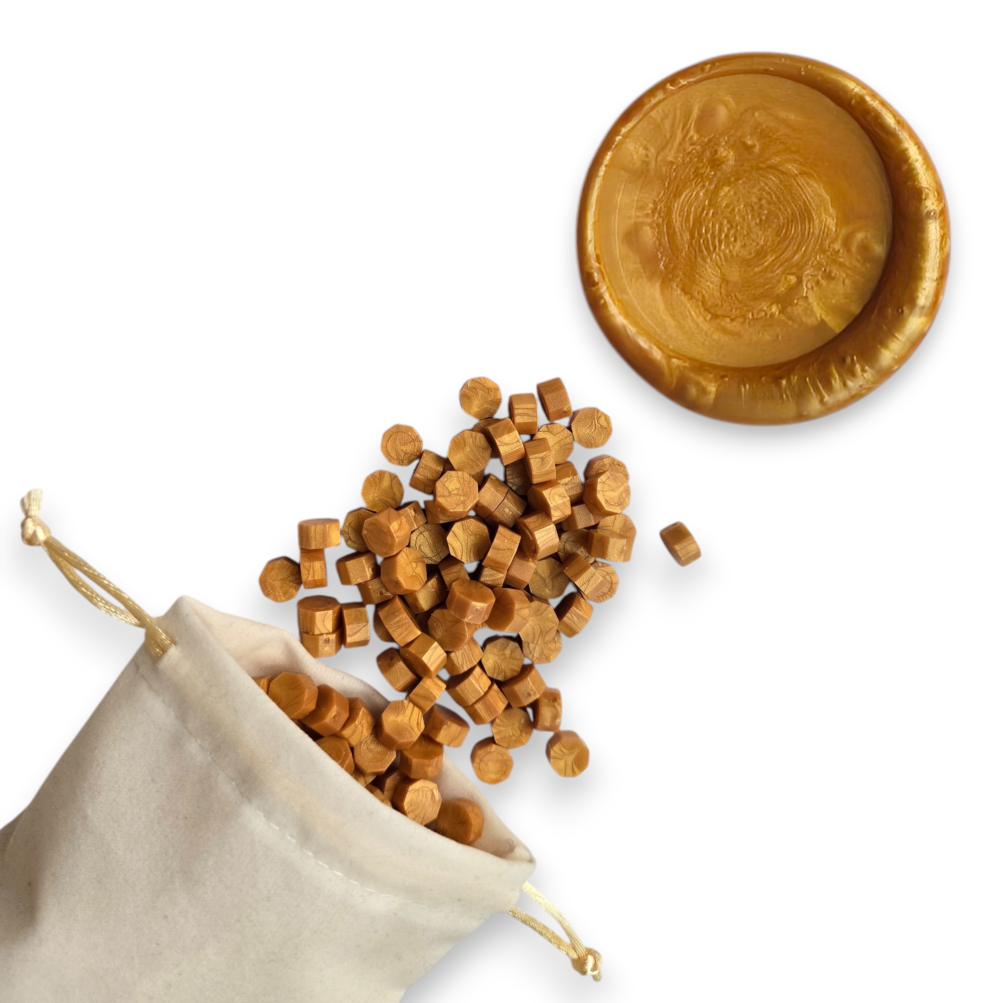 Gold wax beads spilling out of a beige drawstring bag onto a white background. In the top right corner is a blank wax seal in the showcasing the gold colour option.