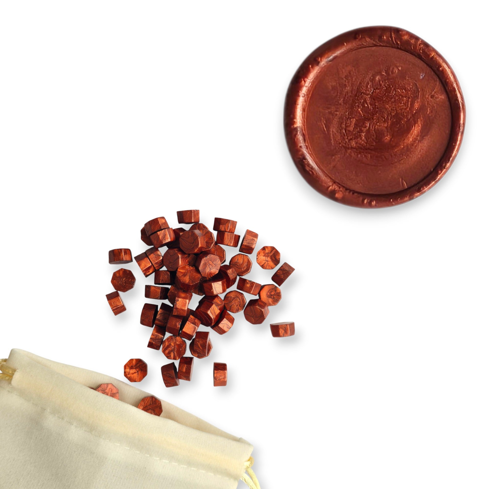 Spice wax beads spilling out of a beige drawstring bag onto a white background. In the top right corner is a blank wax seal in the showcasing the spice colour option.